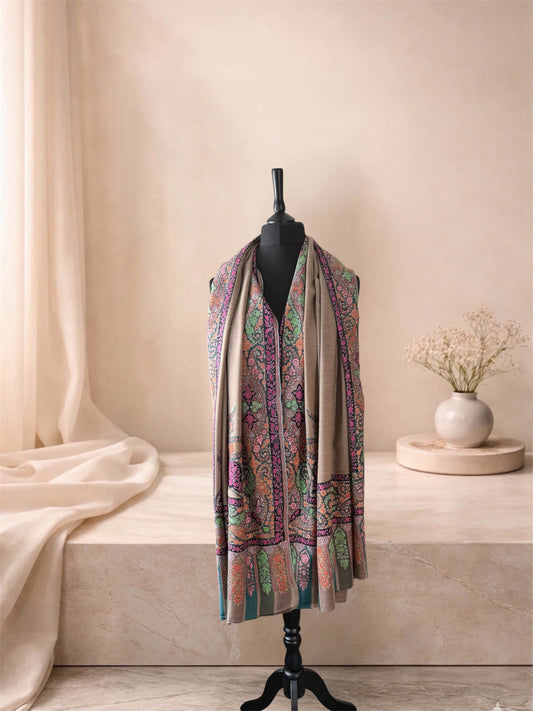 Kalamkari natural beige pashmina shawl worn over the shoulders, front view of the border and end-panels