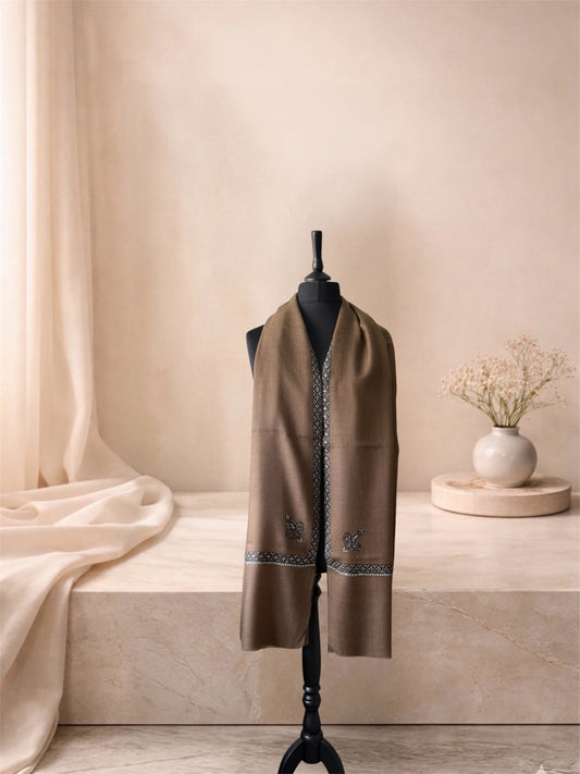 Camel brown pashmina shawl with Sozni border worn over the shoulders, front view