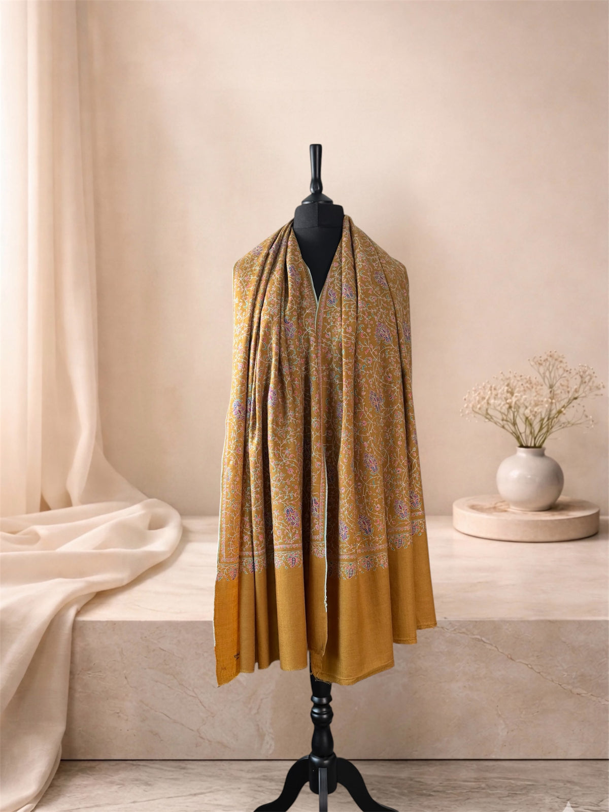 Mustard gold embroidered pashmina shawl worn over the shoulders, front view