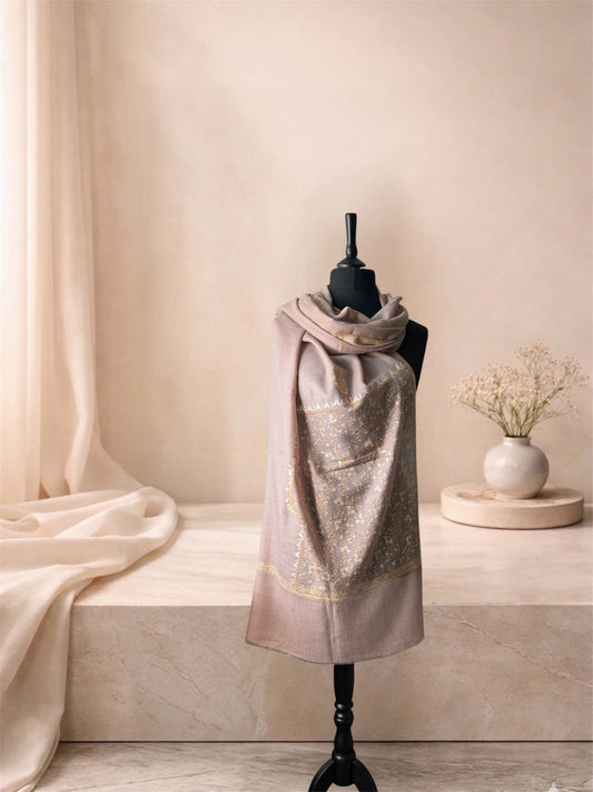 Rose taupe pashmina shawl with gold and mint embroidered panel wrapped at the neck, front view