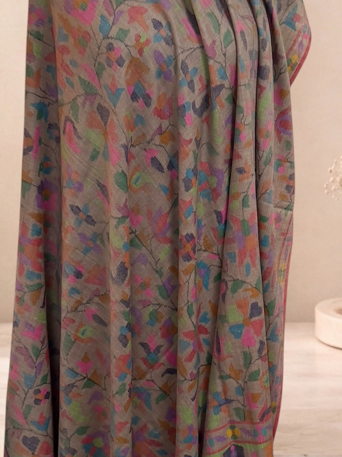 Close-up of a handwoven Kani pashmina shawl with multicoloured floral jaal