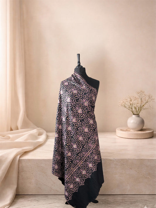 Black pashmina shawl with rose and gold Sozni medallion jaal draped on a mannequin, side view