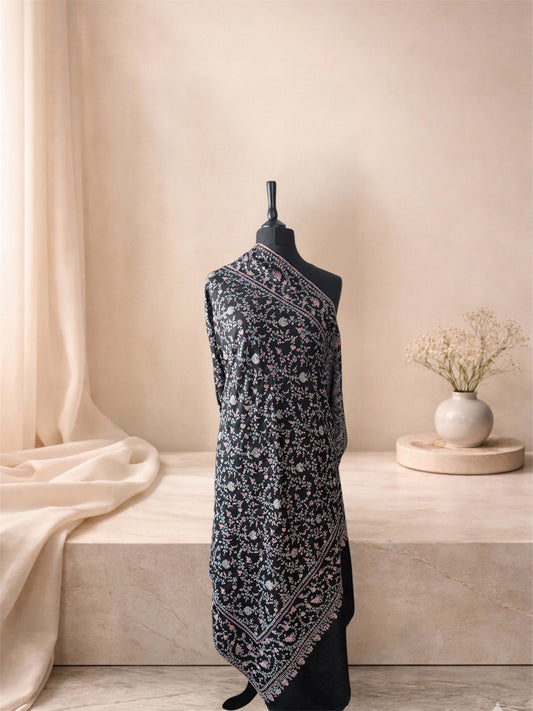 Black pashmina shawl with multicolour Sozni floral vine jaal draped on a mannequin, side view