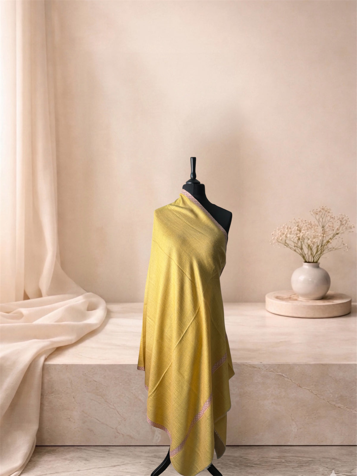 Two-sided mustard yellow and taupe pashmina shawl with lilac border draped on a mannequin, side view