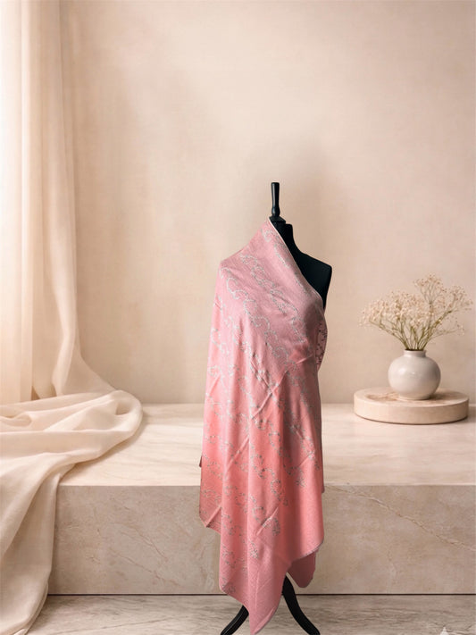 Coral pink pashmina shawl with sage vine stripes draped on a mannequin, side view