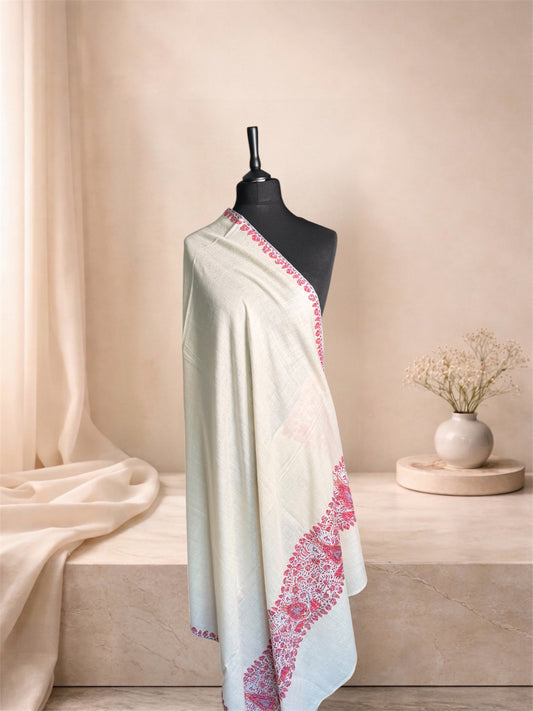 Ivory pashmina shawl with rose paisley Sozni border draped on a mannequin, side view