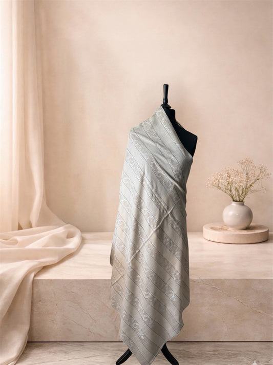 Natural striped pashmina shawl with ivory vine bands draped on a mannequin, side view
