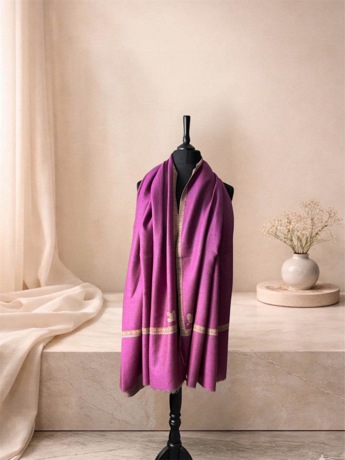 Orchid purple pashmina shawl with gold Sozni border worn over the shoulders, front view