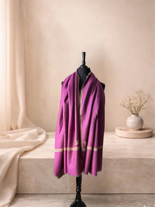 Orchid purple pashmina shawl with gold Sozni border worn over the shoulders, front view