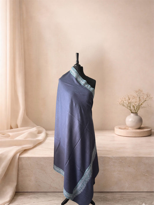 Lavender grey pashmina shawl with ivory floral border draped on a mannequin, side view