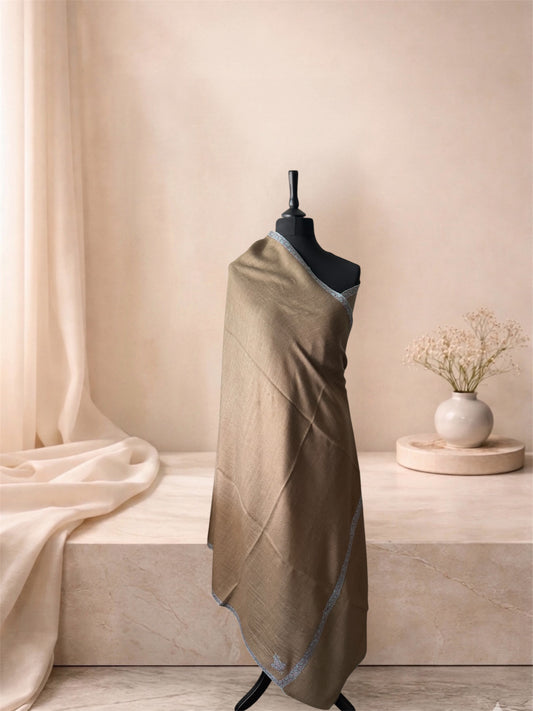 Taupe pashmina shawl with blue-grey border draped on a mannequin, side view