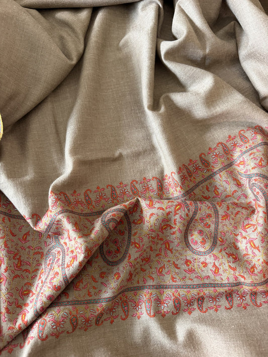 Close-up of coral Sozni jaal with grey outlined paisleys on beige pashmina