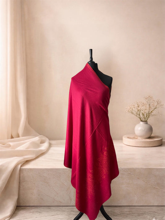 Raspberry red pashmina shawl with tonal embroidery draped on a mannequin, side view