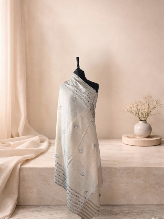 Ivory pashmina shawl with black striped Sozni ends draped on a mannequin, side view