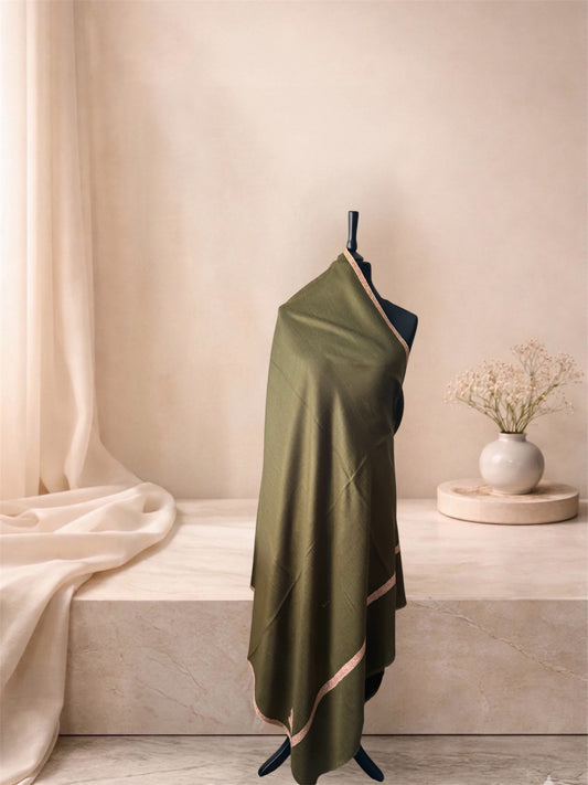 Moss green pashmina shawl with blush pink border draped on a mannequin, side view