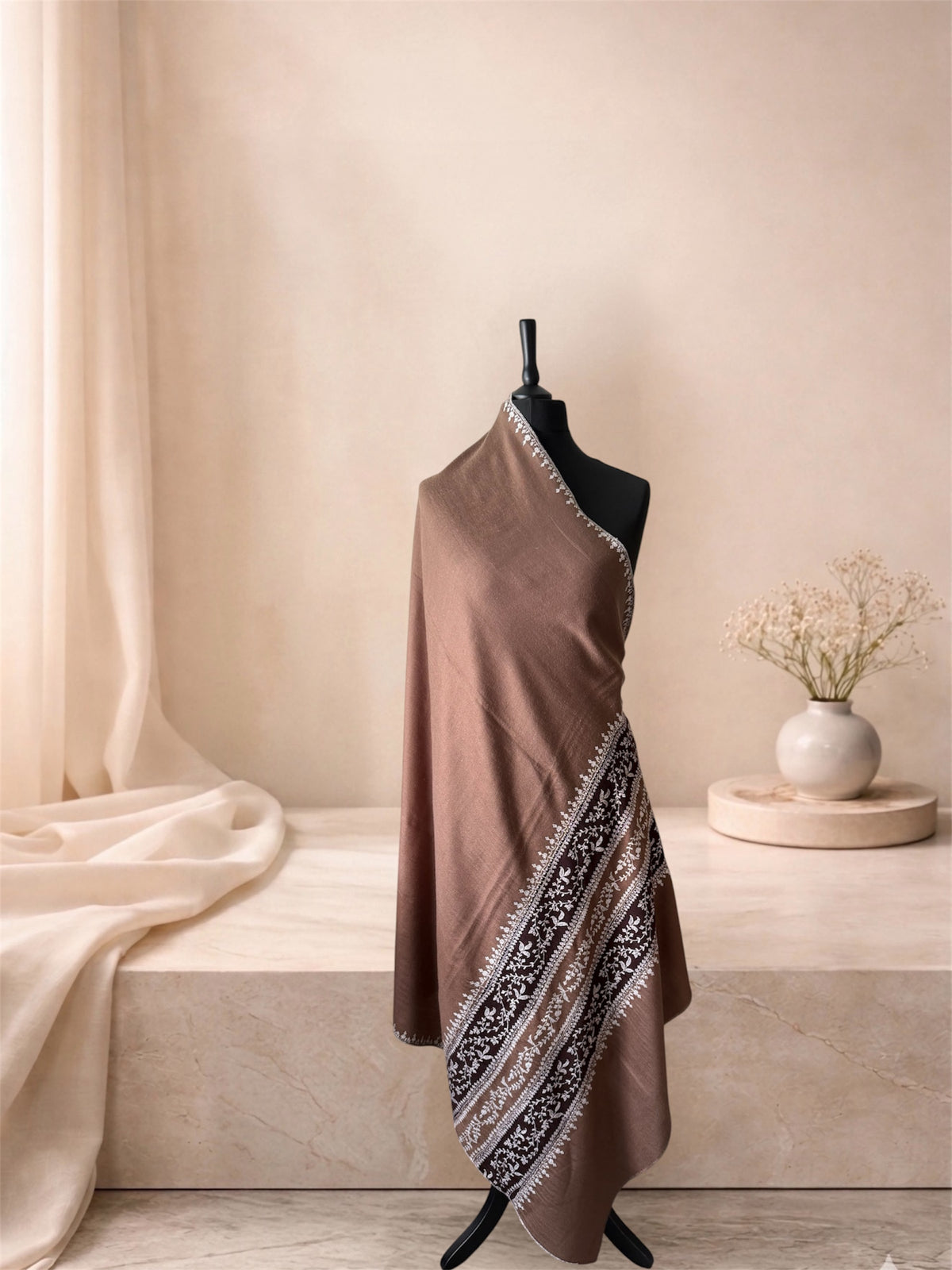 Camel pashmina shawl with embroidered chocolate bands draped on a mannequin, side view