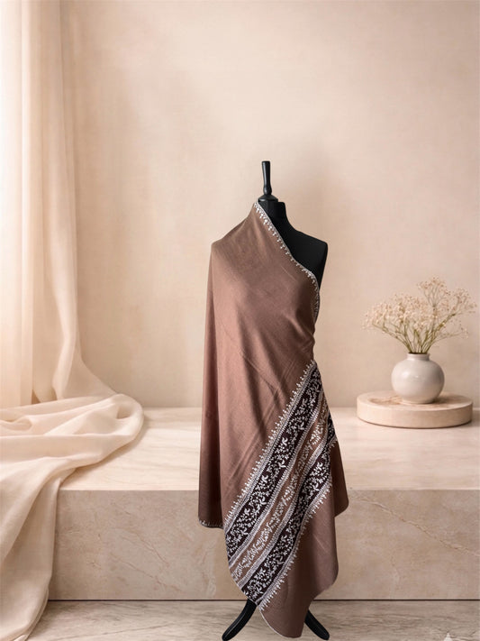 Camel pashmina shawl with embroidered chocolate bands draped on a mannequin, side view