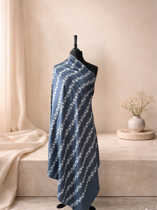 Slate blue pashmina shawl with ivory floral stripes draped on a mannequin, side view