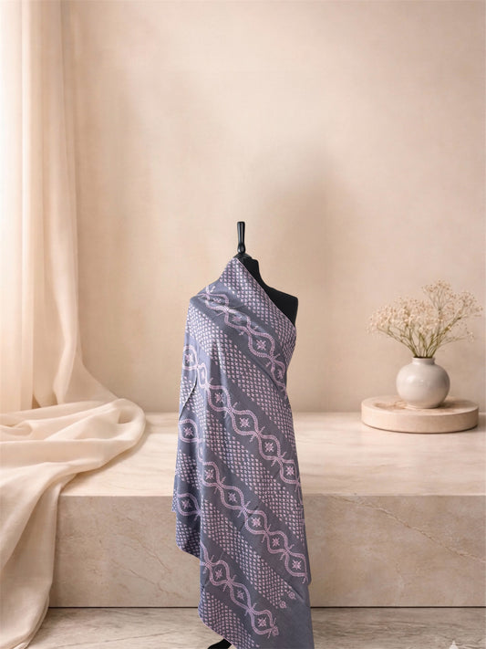 Storm grey pashmina shawl with blush Sozni lattice bands draped on a mannequin, side view