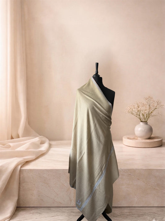 Stone beige pashmina shawl with narrow grey border draped on a mannequin, side view