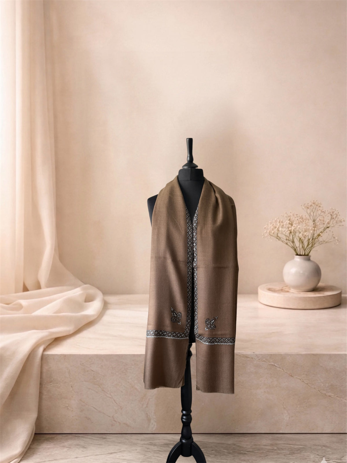 Camel brown pashmina shawl with Sozni border worn over the shoulders, front view