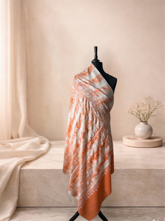 Orange and ivory ikat pashmina shawl with floral embroidery draped on a mannequin, side view