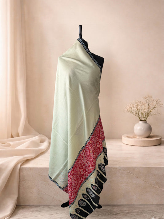 Kalamkari pistachio green pashmina shawl with hand-painted red and black ends draped on a mannequin, side view