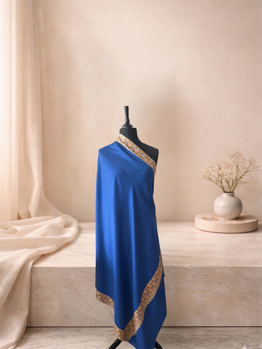 Royal blue pashmina shawl with gold Sozni border draped on a mannequin, side view
