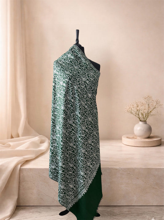 Bottle green pashmina shawl with ivory Sozni jaal draped on a mannequin, side view