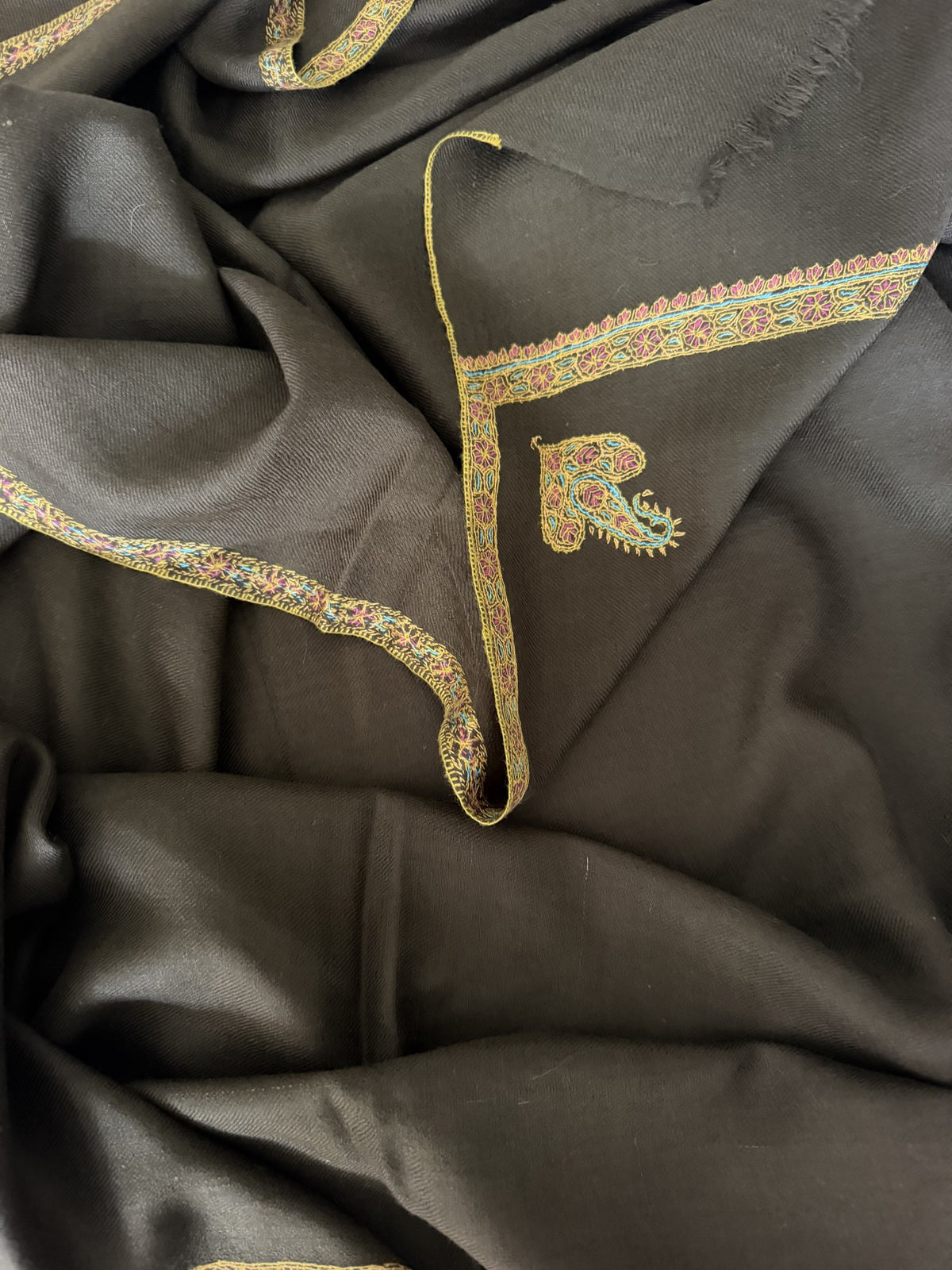Close-up of gold Sozni border and corner paisley on mocha brown pashmina