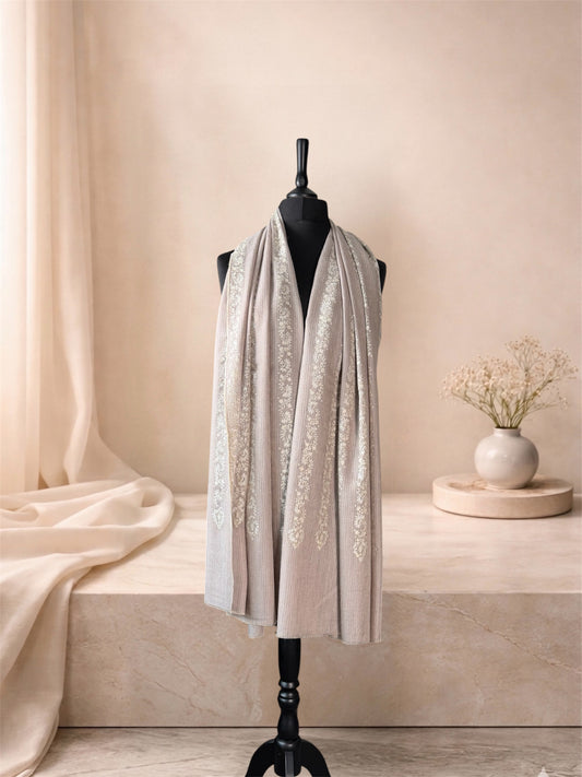 Taupe pashmina shawl with ivory Sozni garlands worn over the shoulders, front view