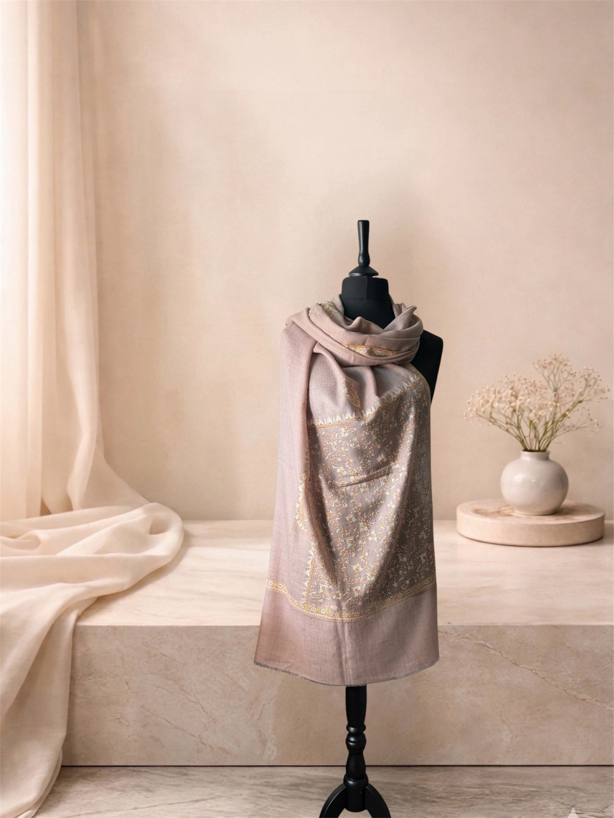 Rose taupe pashmina shawl with gold and mint embroidered panel wrapped at the neck, front view