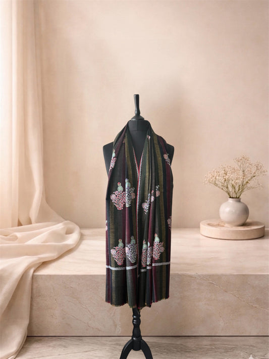 Dark striped pashmina shawl with embroidered floral buta worn over the shoulders, front view