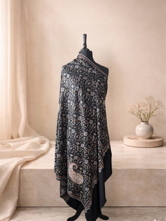 Black pashmina shawl with multicolour Sozni jaal and corner paisley draped on a mannequin, side view