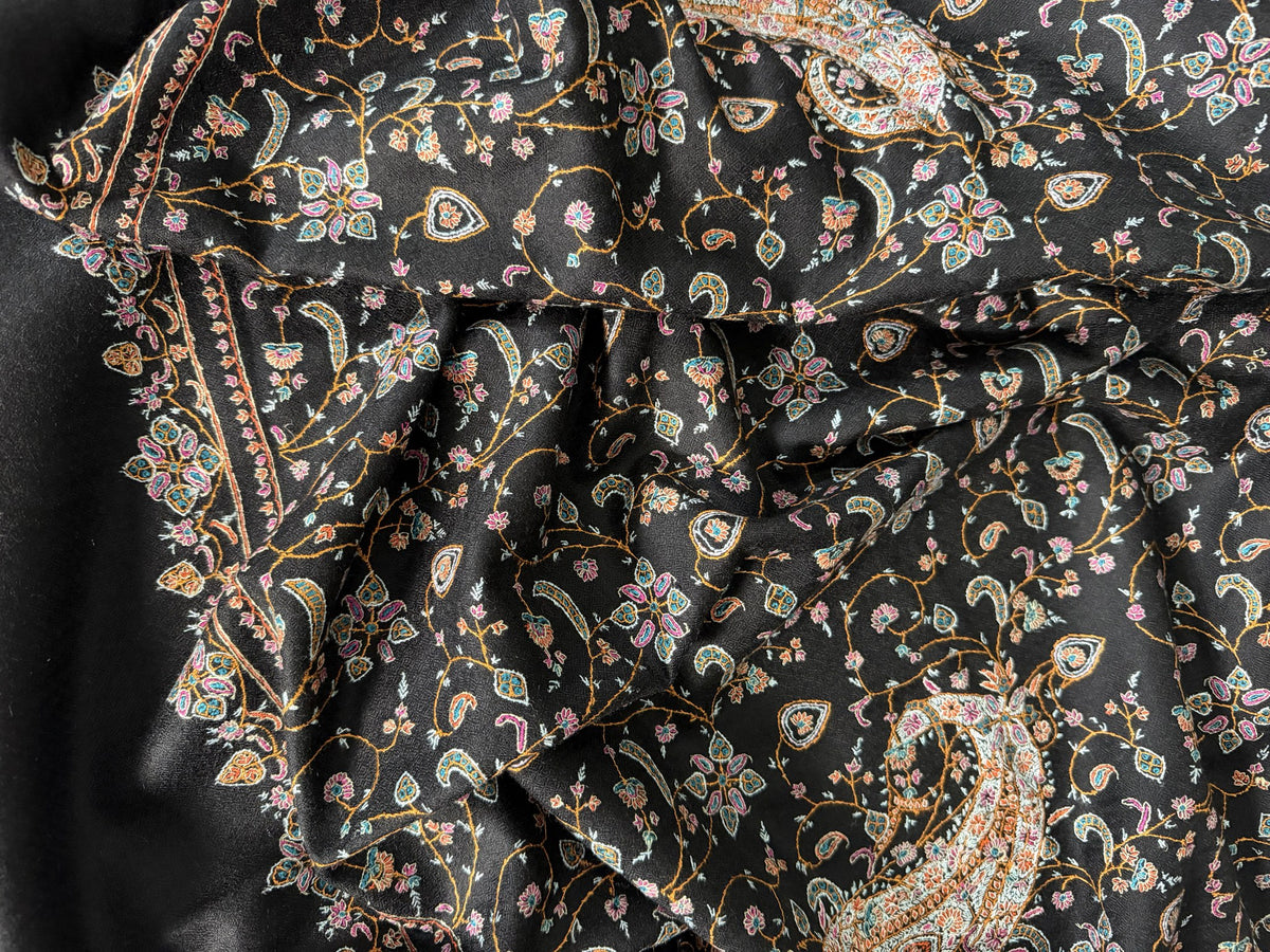 Close-up of multicolour Sozni floral jaal and paisley on black pashmina
