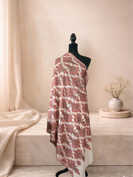 Ivory pashmina shawl with rust red Sozni paisley jaal draped on a mannequin, side view