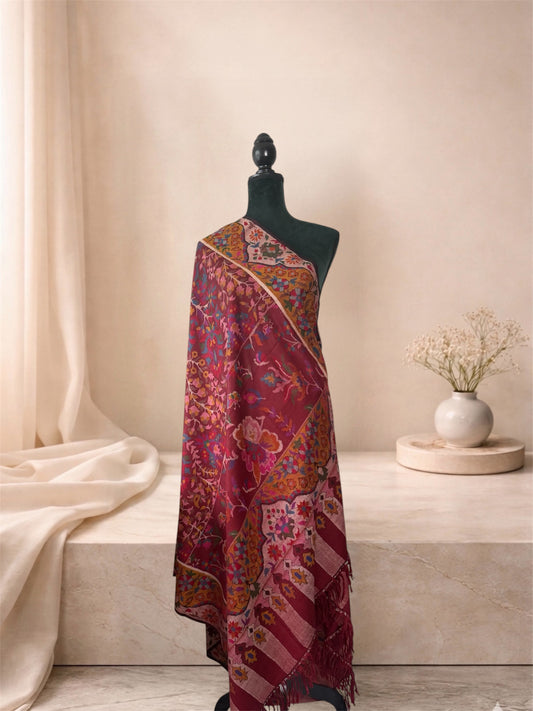 Wine red Kani pashmina shawl with ochre border draped on a mannequin, side view