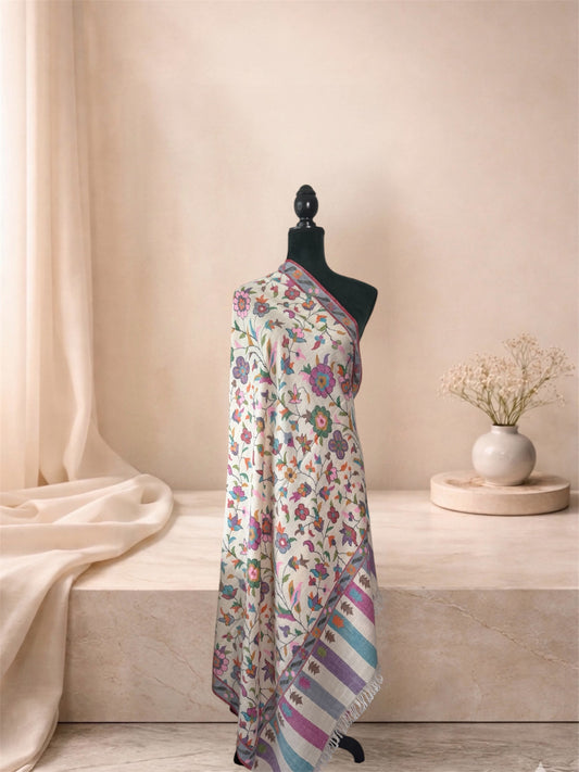 Ivory Kani pashmina shawl with pastel floral vine draped on a mannequin, side view